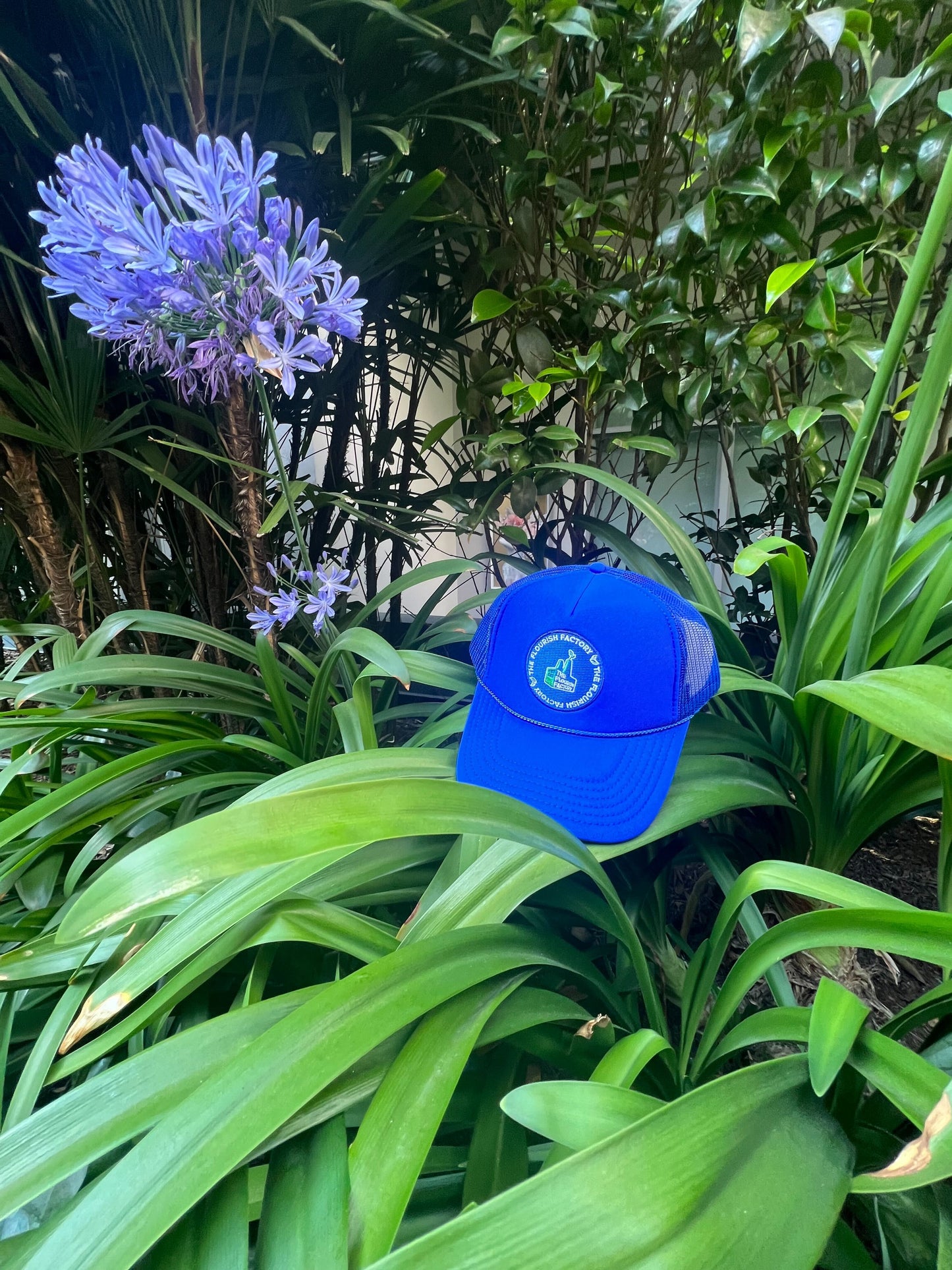 Royal Blue Flourish Factory Trucker Hat